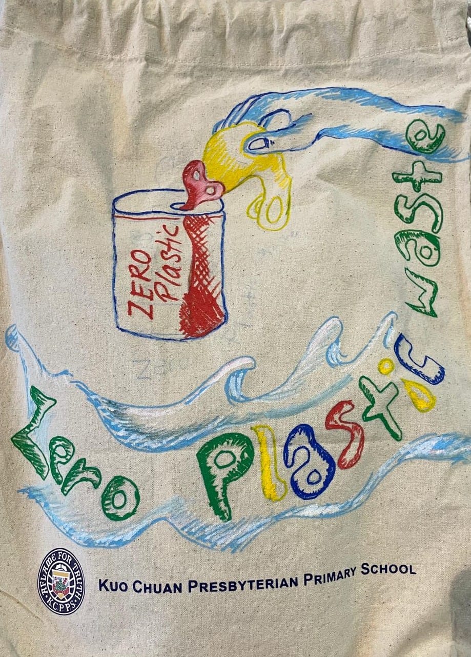 Canvas tote bag with colorful hand-drawn art reading "Zero Plastic Waste" from Kuo Chuan Presbyterian Primary School.